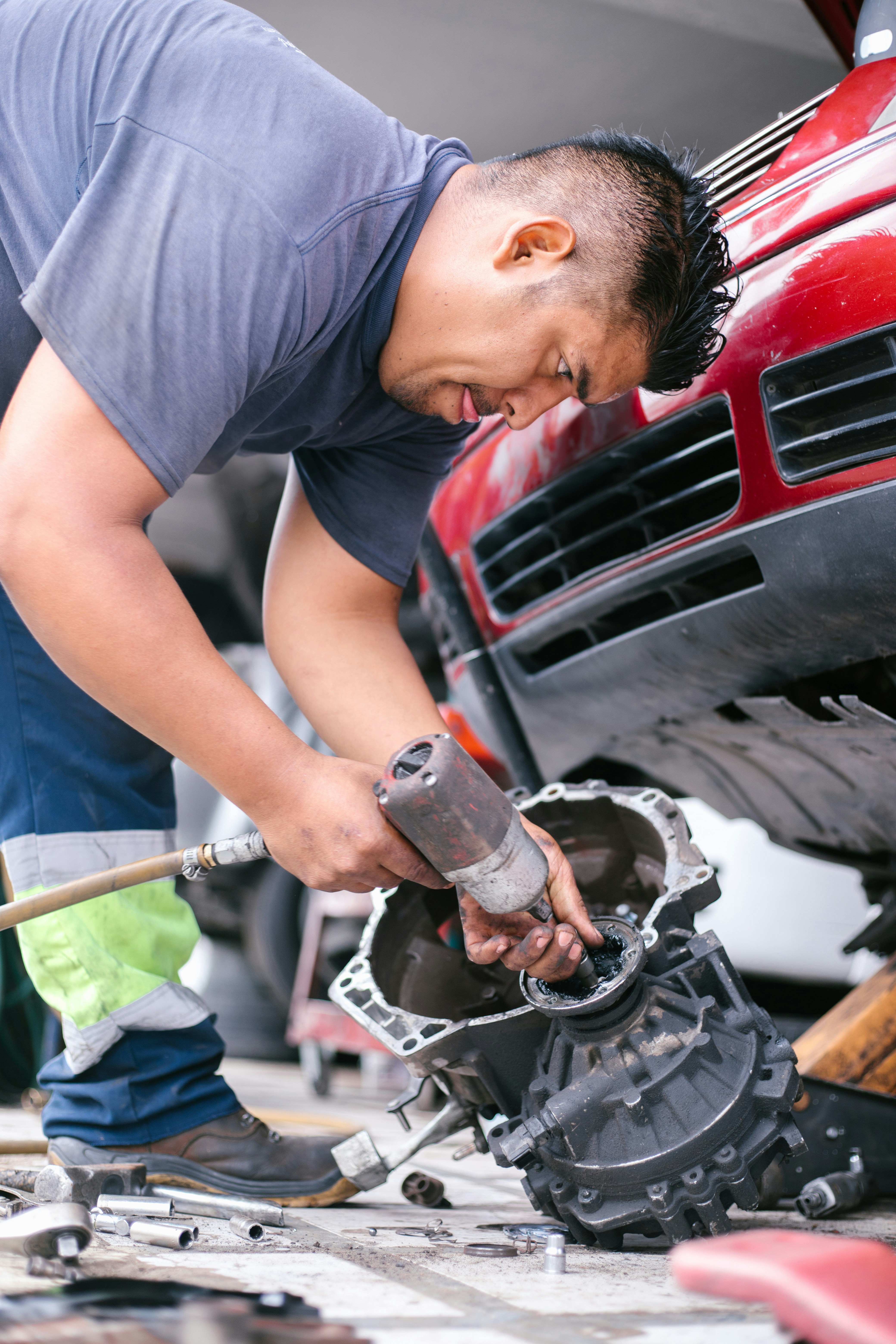 Mechanic working on a transmission rebuild